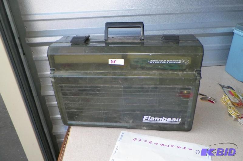 lot 35 image: Tackle Box with a lot of lures and weights.  Box has a break by the hinge.  A lot of great items here.