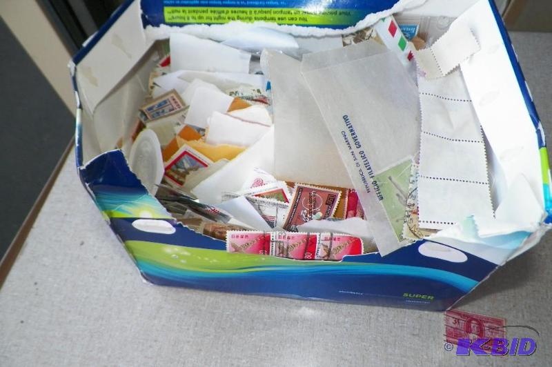 lot 43 image: Large Stamp Collection.  Stamps are in books and loose.  Also includes some used coin books.