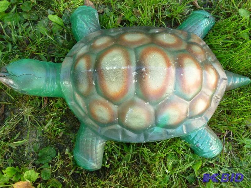 Large cement turtle yard decoration that meas...