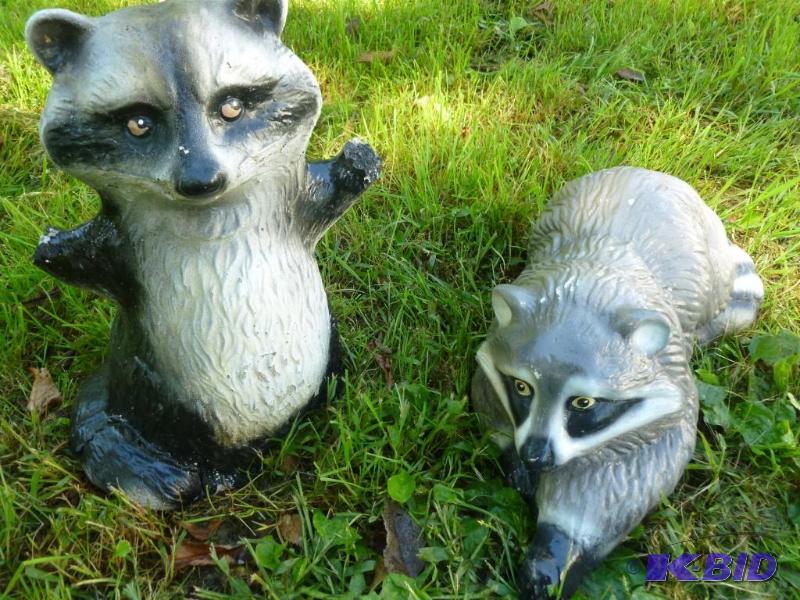 Lot of two cement raccoon yard decorations th...