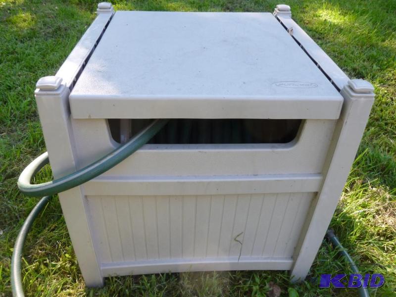 Large Suncast enclosed hose reel with a large...