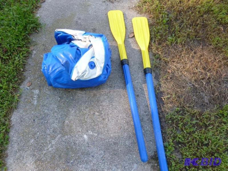 Inflatable raft with oars, appears to be in g...