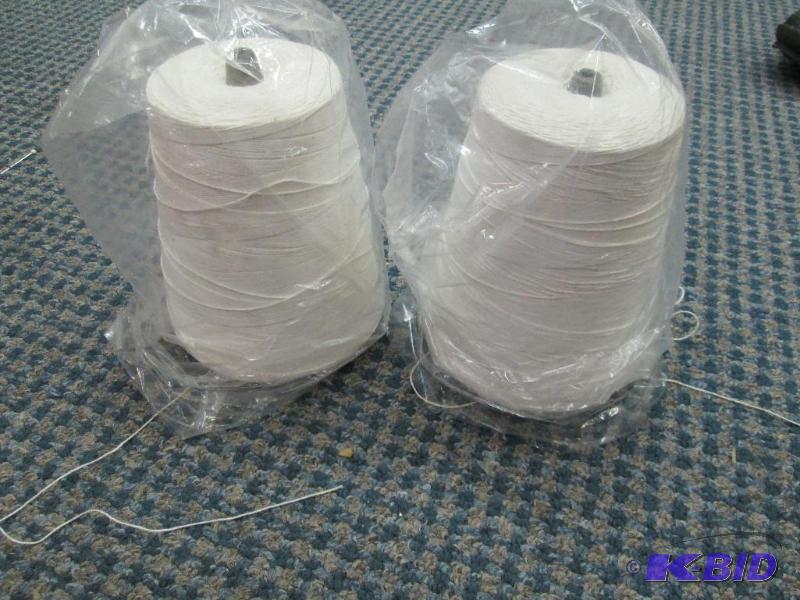 lot 102 image: Qty 2 big spindles of white thread...