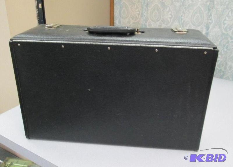 lot 106 image: Hard Black case with key to lock...