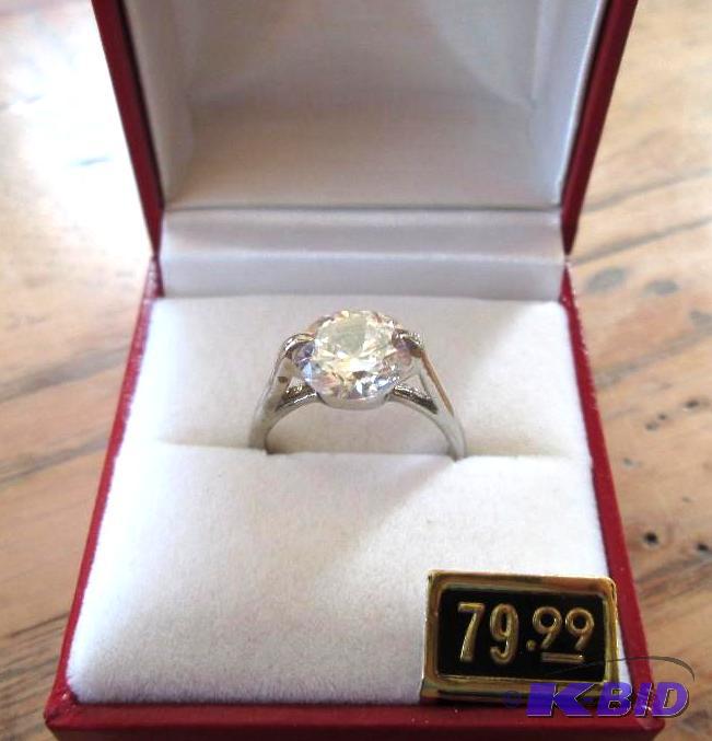 lot 284 image: Silver colored band Ring with imitation diamo...