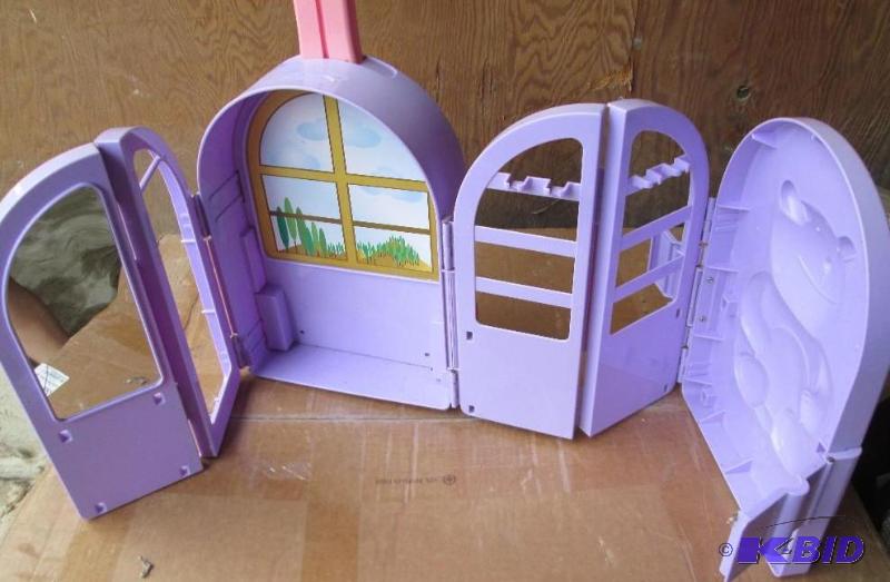 lot 117 image: toy suit case that opens up to a play setting...