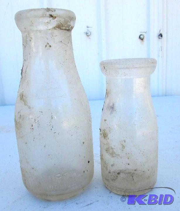lot 23 image: vintage glass bottles, 1 pint and half pint...