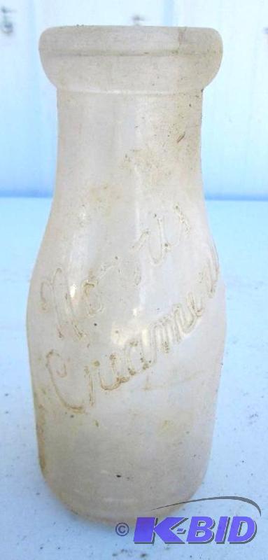 lot 26 image: vintage glass bottle, Norris Creamery...