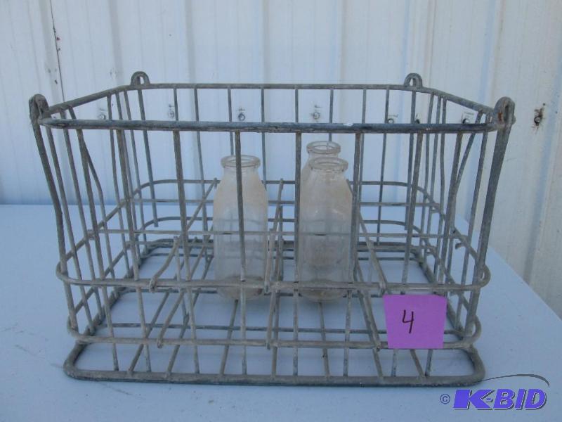 lot 4 image: vintage metal milk crate with 3 glass bottles...