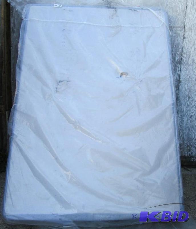 full size boxspring puntured in bottom see pi...