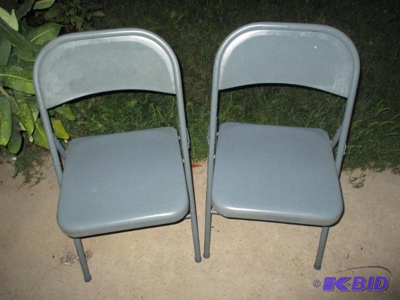 2 light blue folding chairs...