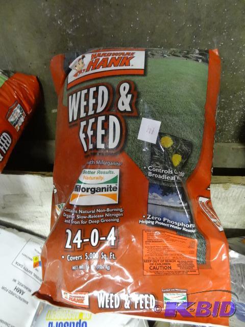 lot 14 image: Approx 16 lbs. Hardware Hank Weed and Feed 24...