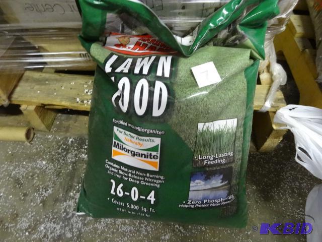 lot 7 image: Approx. 16 lbs Harware Hank Lawn Food 26-0-4...