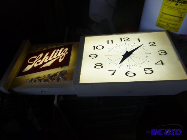 lot 13 image: Schlitz Beer Light Clock Lights work, clock d...