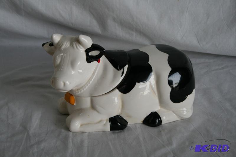 Cow cookie jar, looks like it may have been g...