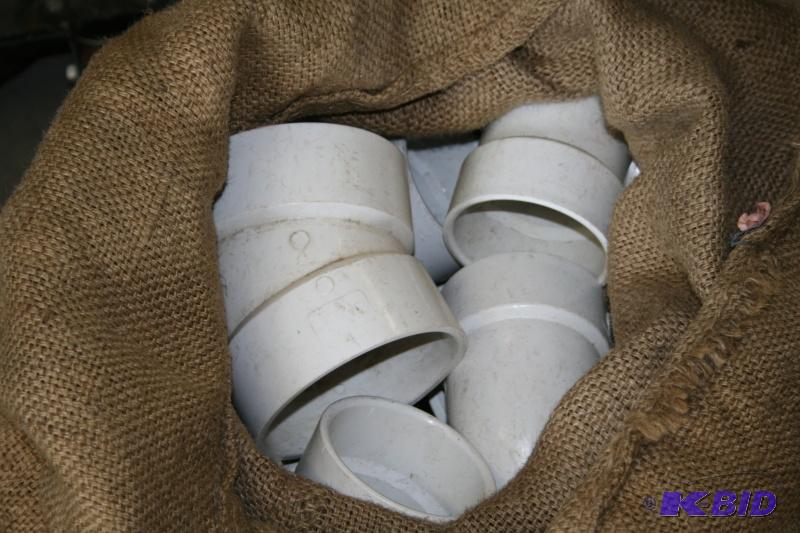 Burlap bag of misc. plumbing PVC adapters...