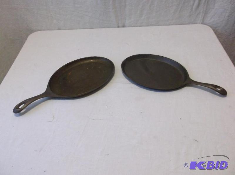 lot 30 image: Pair of cast iron skillets both appear in goo...