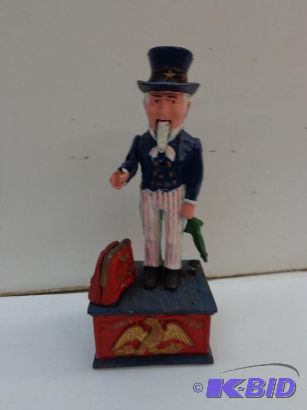 lot 76 image: Cast Iron Hand Painted Uncle Sam Bank All Mov...