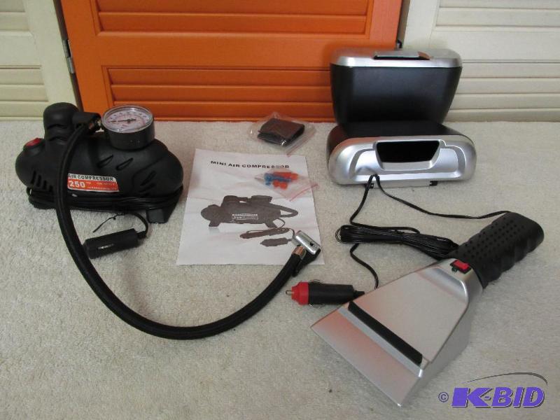 lot 102 image: 12 Volt Air Compressor, Two Auto Pockets and a Heated Ice Scrapper.