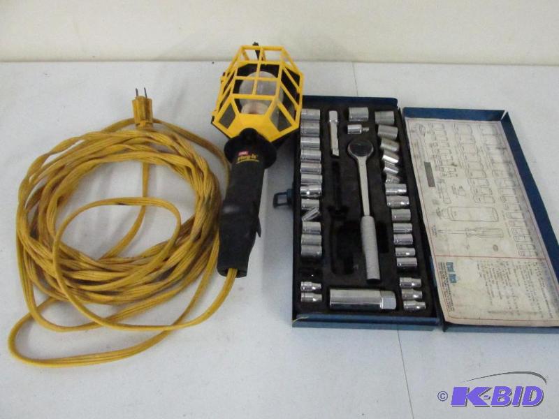 lot 106 image: Trouble Light, Extension Cord, and A Socket Set Missing a Few Pieces.
