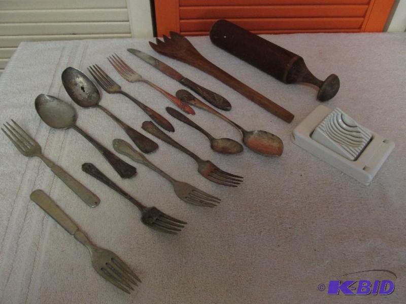 lot 93 image: OLD Flatware, Egg Slicer, Wooden Salad Fork and a Pestle.