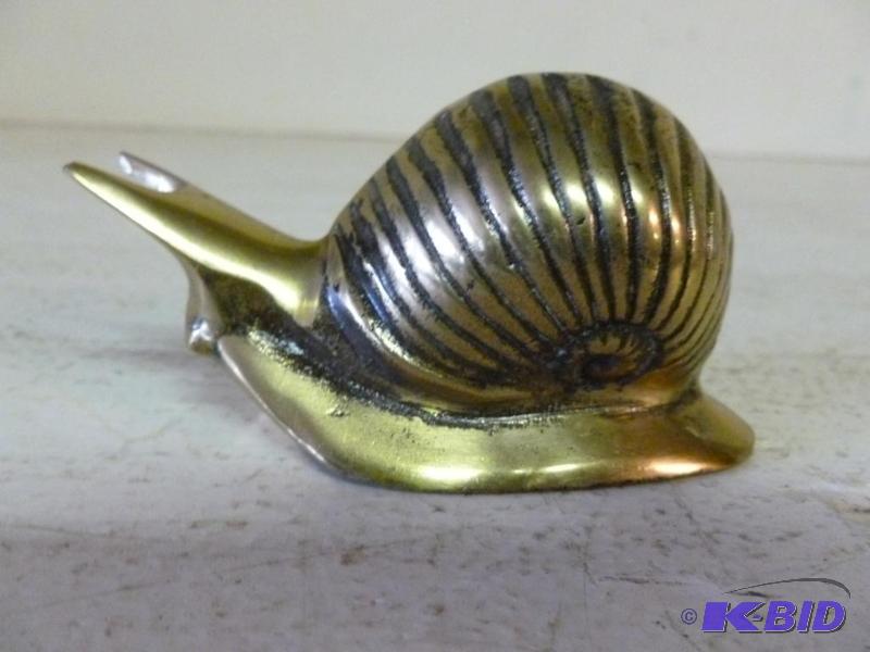 Vintage cast brass snail decoration that meas...