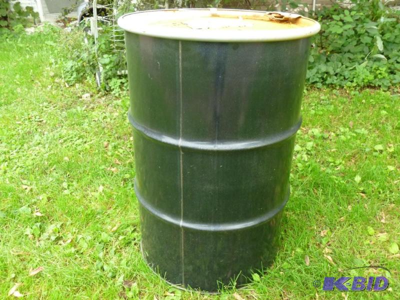 Large 55 gallon steel drum with lid, was fill...