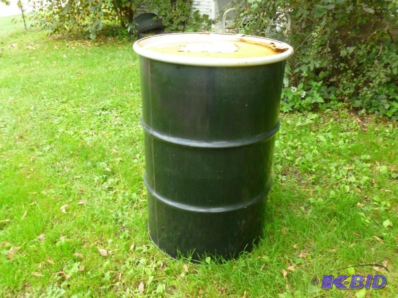 Large 55 gallon steel drum with lid, was fill...