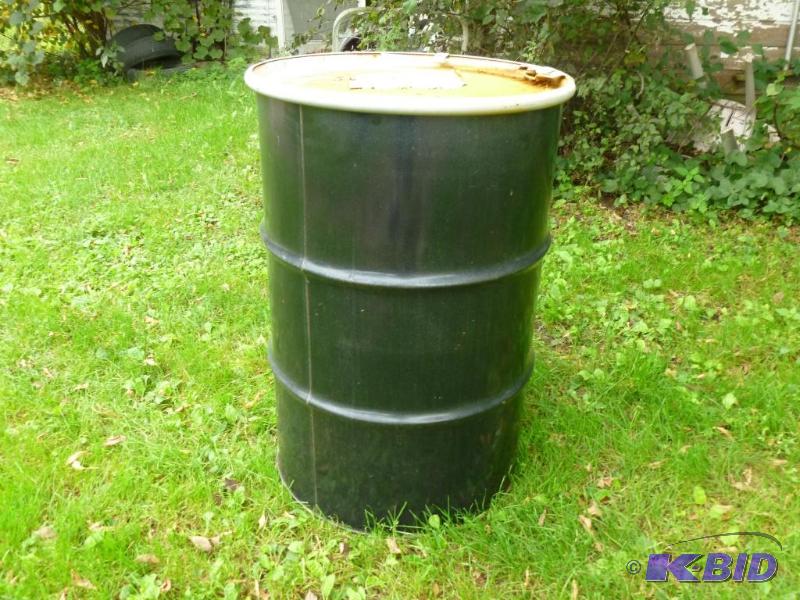 Large 55 gallon steel drum with lid, was fill...