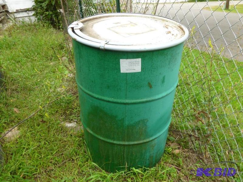 Large 55 gallon steel drum with lid, was fill...