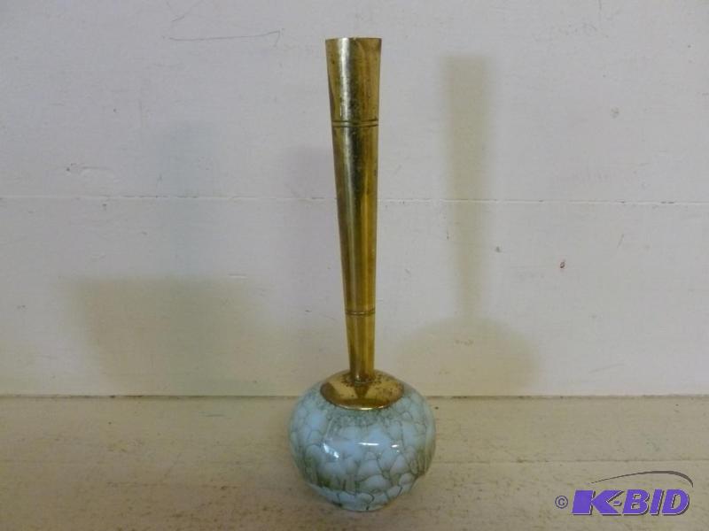 Decorative brass and porcelain bud vase that ...
