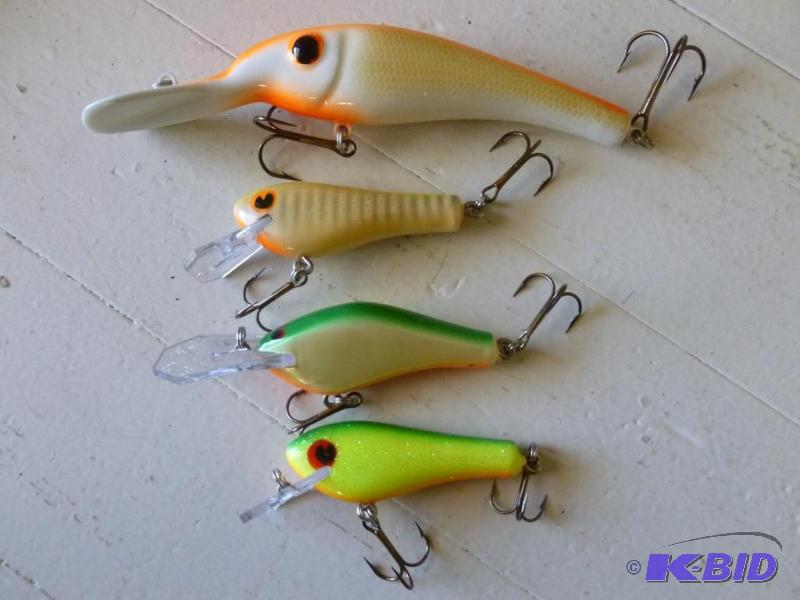 Lot of four large crank type fishing baits....