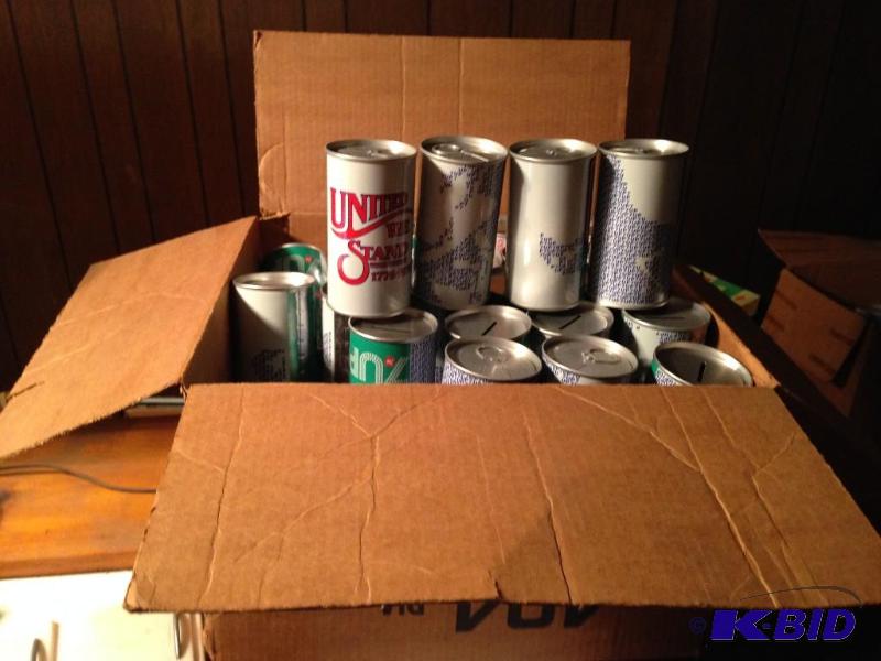 lot 146 image: 7 Up Bank Cans.  54 total.  Could be the whole set.  When put together there was a map of the US I believe.  You will never see another set like these as they were all made with pop in therm.