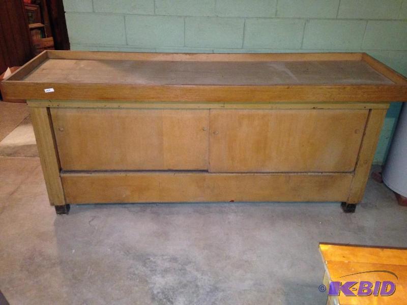 lot 154 image: Cabinet with two sliding doors   84 x 27 x 36 inches high.  THIS WILL REQUIRE TWO PEOPLE TO GET IT OUT SO BRING HELP.  WE WILL NOT HAVE HELP AVAIOLABLE.  IT IS LOCATED IN A BASEMENT.