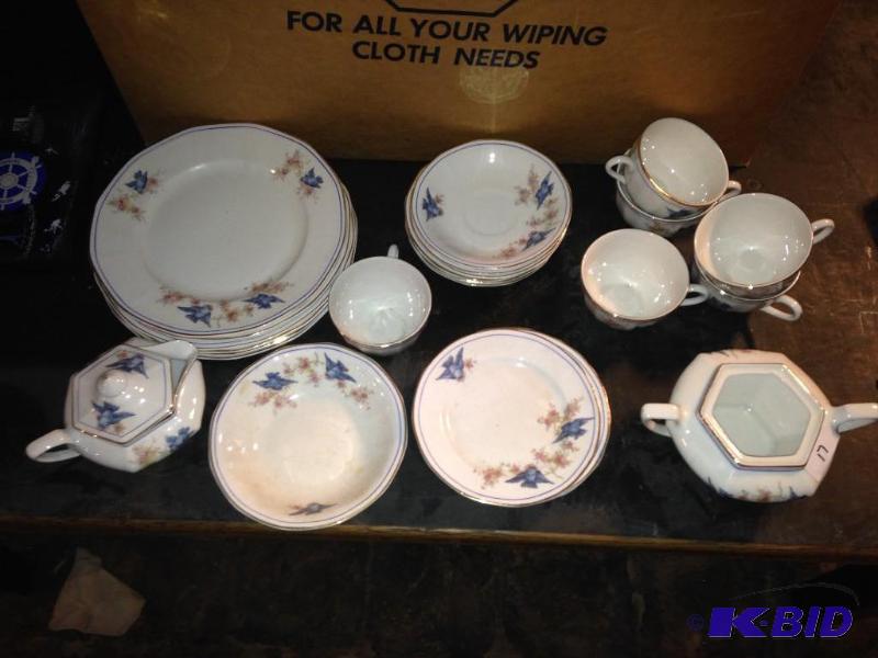 lot 17 image: Blue Bird China Pieces.    7 plates, 6 saucers, 6 coffee cups, 6 small plates, 1 creamer & sugar.