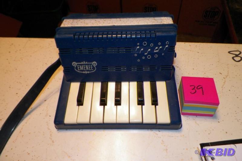 lot 39 image: Emenee Blue Concertina- no rips or tears.  Works Fine.
