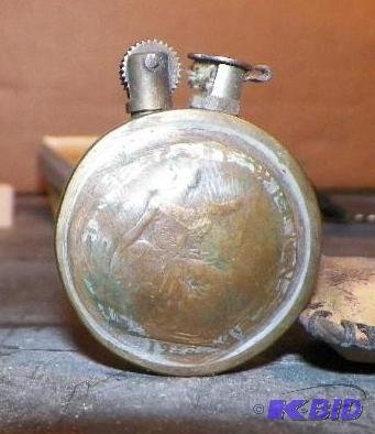 lot 52 image: Possible WW I Trench Art Piece.  Nice Lighter with 2 British Pennies the one is dated 1914