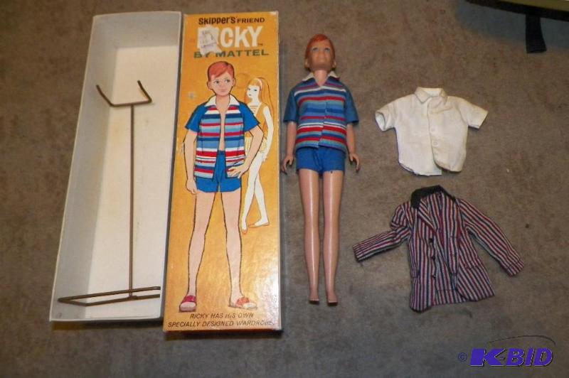 lot 9 image: 1964 ORIGINAL Ricky Doll in ORIGINAL box, outfit, shoes and stand.  Also 2 additional Ricky shirts.
