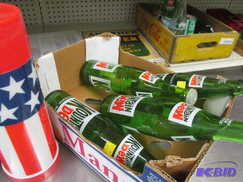 lot 18 image: Vintage Mountain Dew bottles