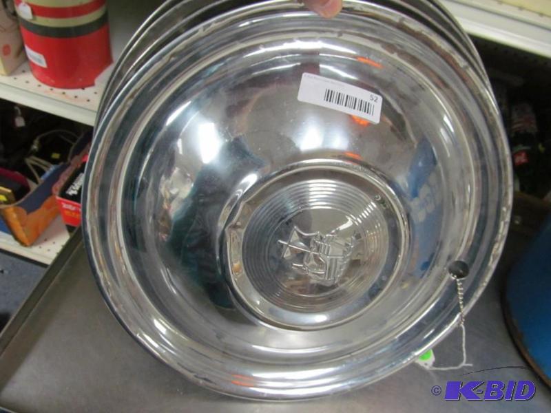 lot 52 image: Lot of 4 vintage auto wheel hub caps