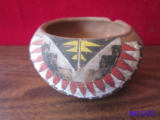 4 inch hand painted Native clay pot, has chip...