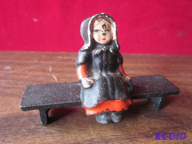 Antique cast iron girl on bench.&nbsp...