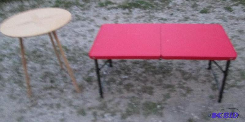 small red collapsible table for travel with a...