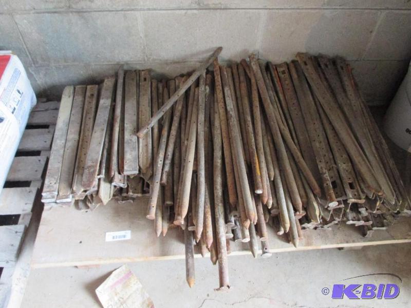 lot 51 image: Pallet of cement form steel stakes, probably ...