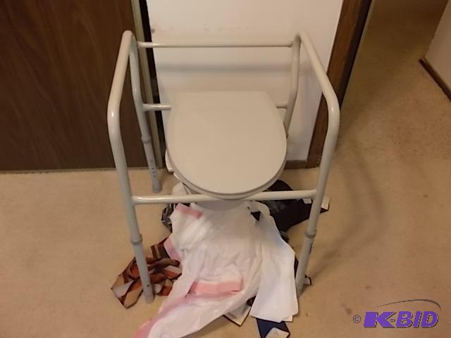 lot 5 image: Porta Potty & Over The Toilet Seat With A...