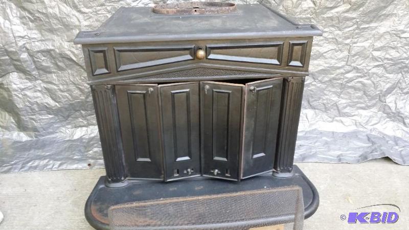 lot 2 image: Wood burning fireplace stove, maker unknown S...