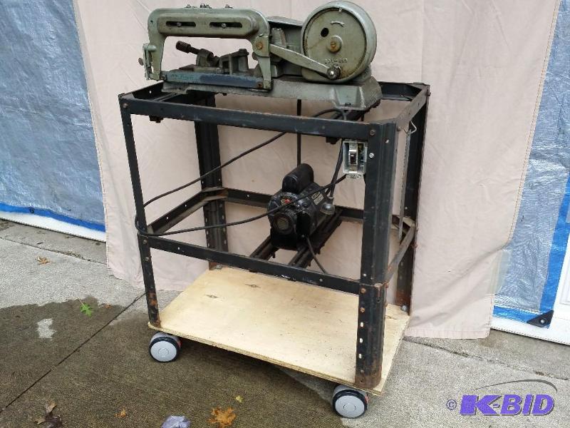 lot 29 image: Sears Roebuck and Co Saw on cart with casters...
