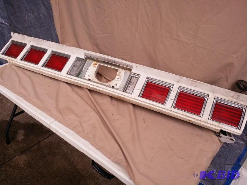 lot 36 image: Tail light off an early 80s Chevy Impala...