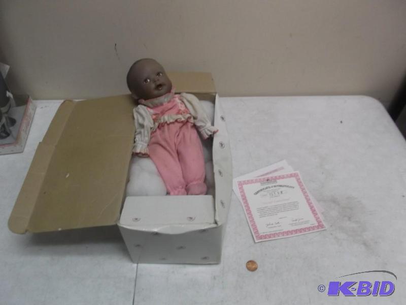 lot 104 image: Porcelain Baby, Has Some Stains On Clothes...