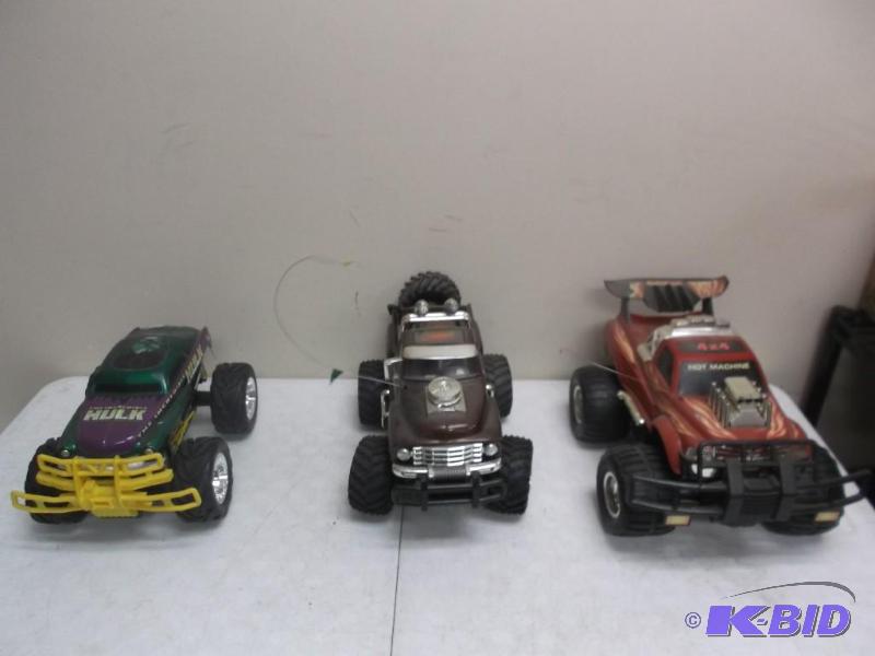 lot 180 image: Lot Of Three RC Trucks, Missing Controls...